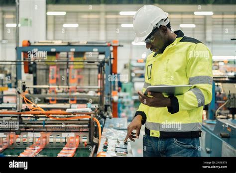 Technician Working In Factory Check Functionality While Commissioning A