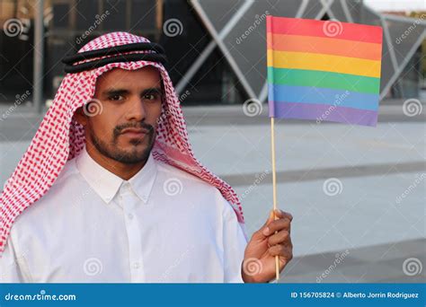 Attractive Arabic Gay Man Holding The Rainbow Flag Stock Photo Image Of Kandura Arab