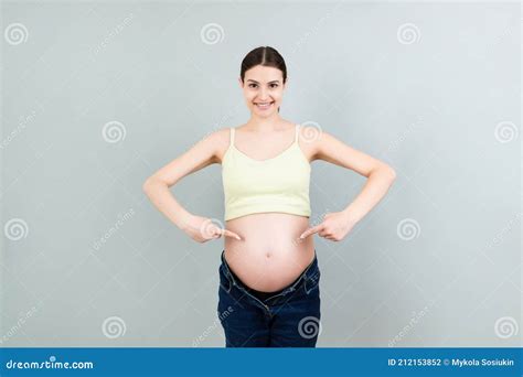 Young Beautiful Teenager Girl Pregnant Expecting Baby Over Isolated