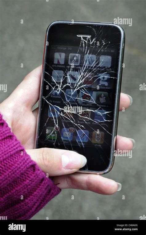 A broken iPhone with a cracked screen Stock Photo - Alamy