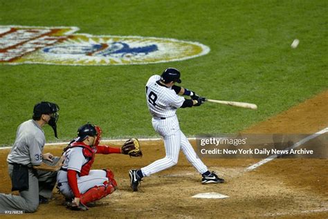 New York Yankees' Aaron Boone hits a solo home run in the 11th inning ...