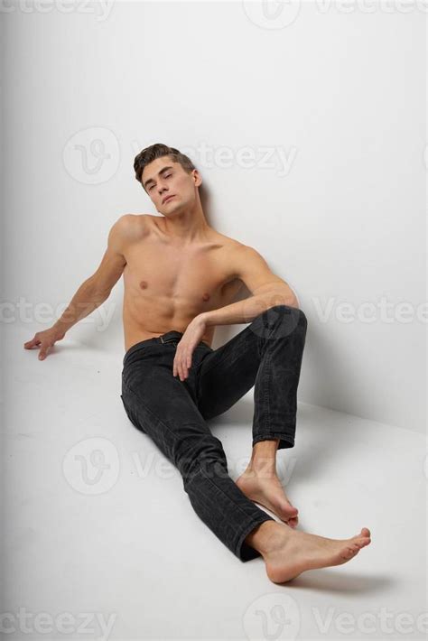 Handsome Man In Black Trousers Sits On The Floor Naked Torso Studio Attractiveness