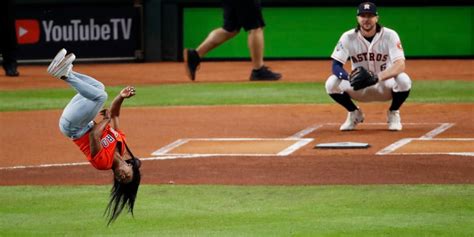 Watch Simone Biles Flip Before Throwing World Series Pitch Popsugar Fitness