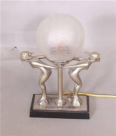 Lot ART DECO NUDE SILVER AND BLACK METAL NOVELTY LAMP