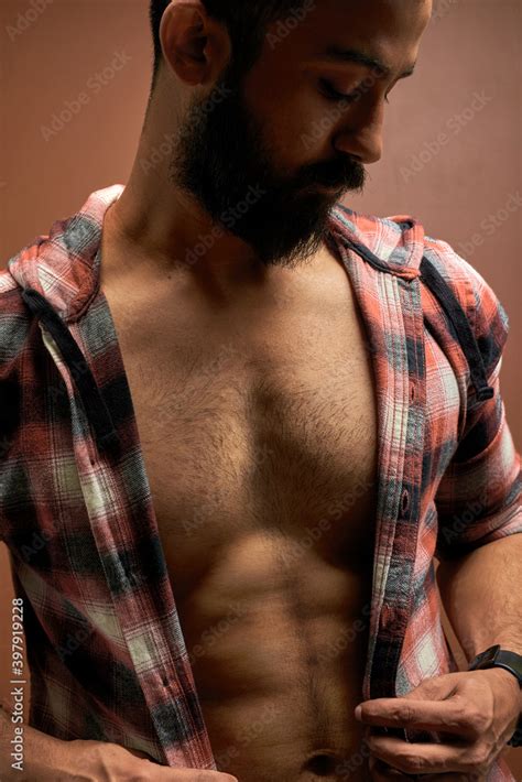 Half Naked Sexy Male Wearing Shirt On Muscular Body Posing Bearded Guy Looking Down Isolated