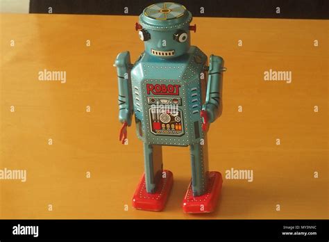 Tin Toy Robot Grey Tray With Red Hands And Feet Stock Photo Alamy