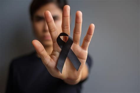 Premium Photo Close Up Of Human Hand Against Black Background