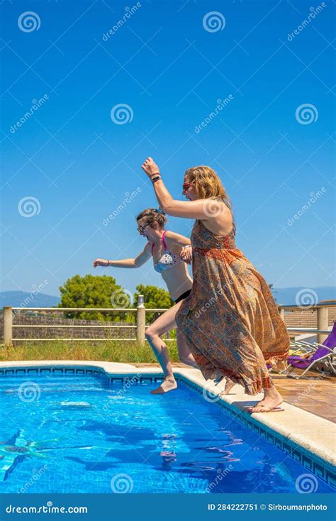 Two Lesbian Couple Friends Laughing With A Surprised Face And Having A Good Time Starting A Jump