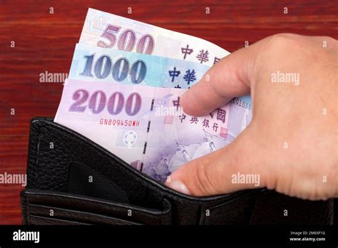 New Taiwan Money Dollar In The Black Wallet Stock Photo Alamy