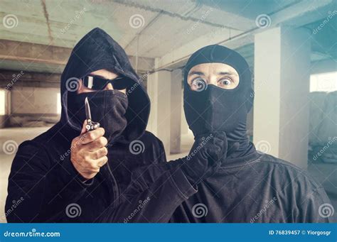 Dangerous masked criminals stock image. Image of burglar - 76839457