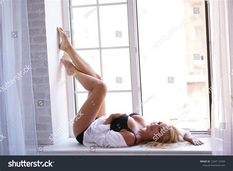 Beautiful Blonde Girl Flaunts On White Stock Photo 1244110420 Shutterstock