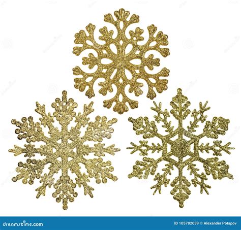 Tre Decorazioni Di Forma Del Fiocco Di Neve Dell'oro Isolate Su Bianco