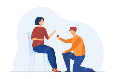 Мужчина становится на одно колено и делает небольшой подарок женщине ...