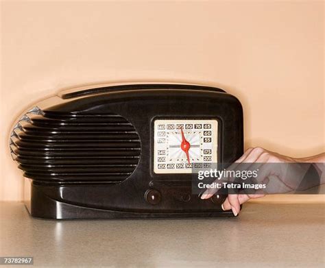 Woman Turning On Radio Photos And Premium High Res Pictures Getty Images