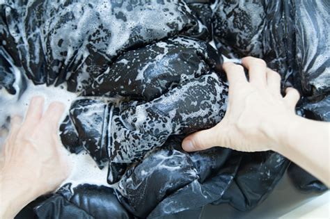 Hand Washing Down Jacket In Bathtub Stock Photo - Download Image Now ...