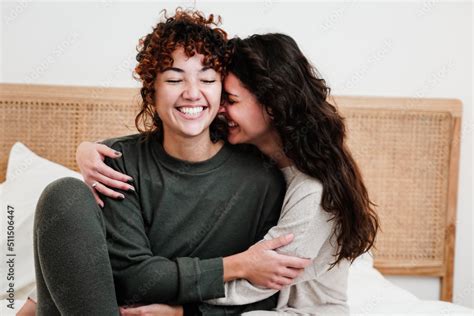 Gay Female Couple Surprising Lover With Engagement Ring In Bed At Home