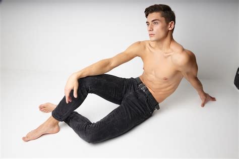 Premium Photo Man Sitting On The Floor Naked Torso Casual Wear
