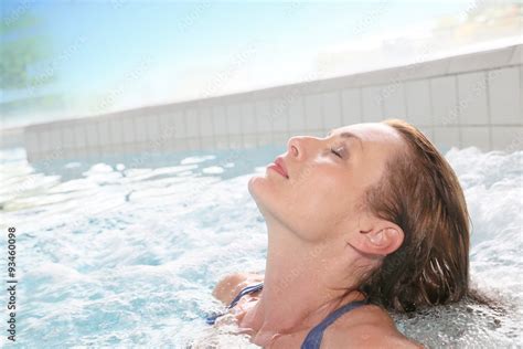 Beautiful Woman Relaxing In Hot Tub Of Spa Center Pool Stock Photo Adobe Stock
