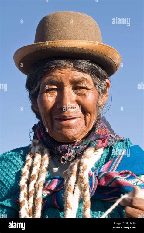 Potosi, Bolivia, Llama Herdswoman wearing a bowler hat also called