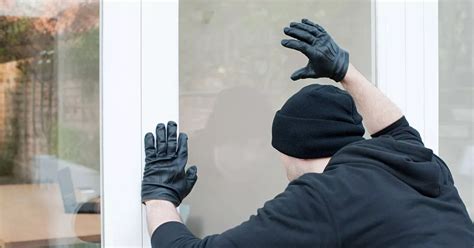 Woman With Long Blonde Hair Stealing From Safe And Burglars Sneaking Over Roofs Among