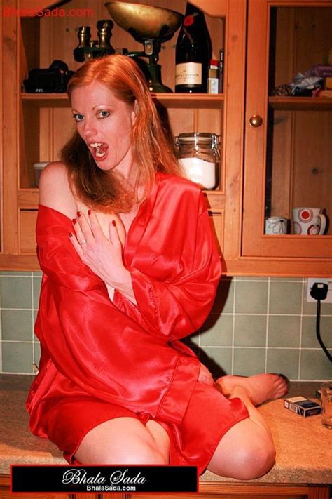 Gorgeous Babe Loves Posing Just In Her Red Robe Photos