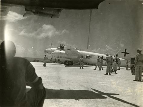 Military Police Gathering Around A Japanese Bomber At Ie Shima Airfield