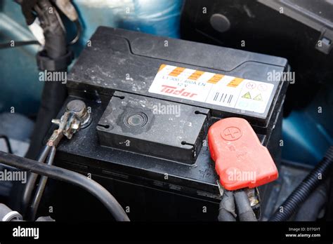 Car Battery Connected In A Car Engine Compartment Stock Photo Alamy