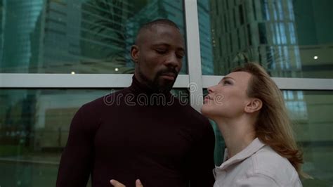 American Blonde Woman Is Posing In Private Plane Wearing Blue Bodysuit With White Stars Stock
