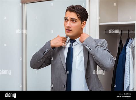 Businessman Dressing Up For Work Stock Photo Alamy