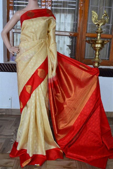 Cream Pure Kanchivaram Silk Saree With Red Zari Butta Border And Thread