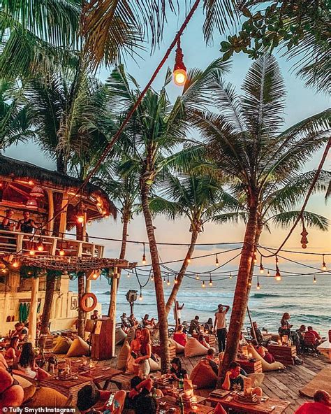 Tully Smyth Shows Off Her Washboard Abs In A Skimpy Bikini While Enjoying A Tropical Holiday In