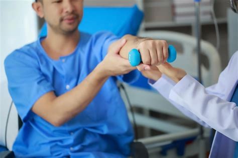 Premium Photo Physical Therapist Helping A Patient In Physical