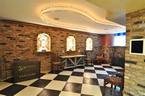 Entertaining room with brick wall, tile floor and unique custom