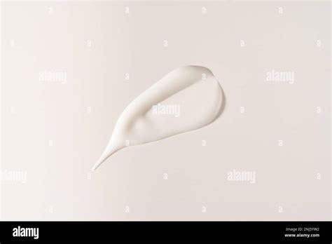 A smear of cosmetic cream. A white creamy drop of skin care cream ...