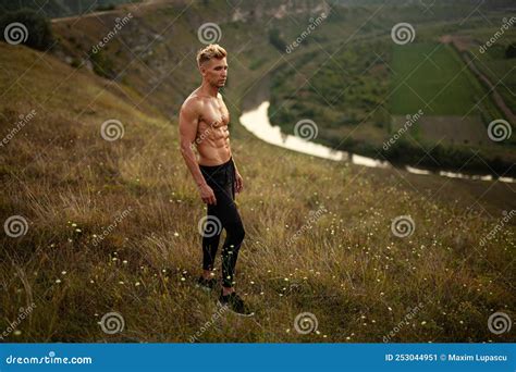 Self Assured Sportsman With Naked Torso Admiring Nature After Outdoor Training Stock Image