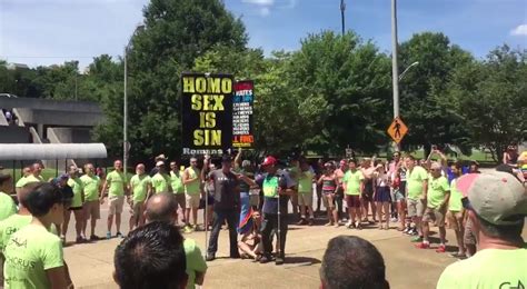 Gay Men S Choir Form Circle Around Anti Gay Pride Protesters Drown Them Out With Song Attitude