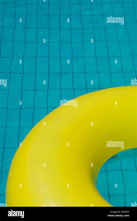 yellow rubber ring  swimming pool stock photo alamy