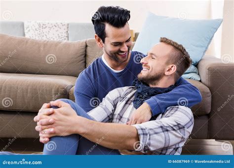 Gay Couple Hugging On The Couch Stock Image Image Of Enjoying Leisure 66087969