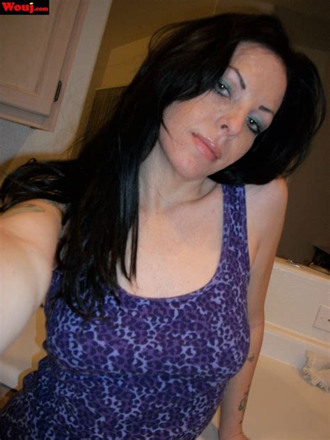 Tattooed Brunette Girl Taking Pictures Of Her Nice Round Ass Photos