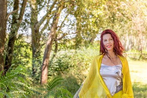 German Mature Woman In A Green Garden Stock Photo Image Of Silver