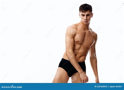 Naked Athlete With A Pumped Up Torso And In Black Panties Leaned To The Side Cropped View Stock