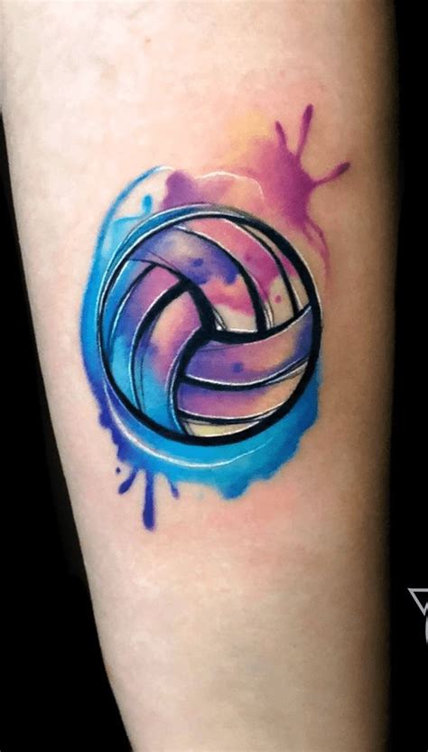 A Colorful Tattoo On The Leg Of A Woman With An Artistic Blue And Pink