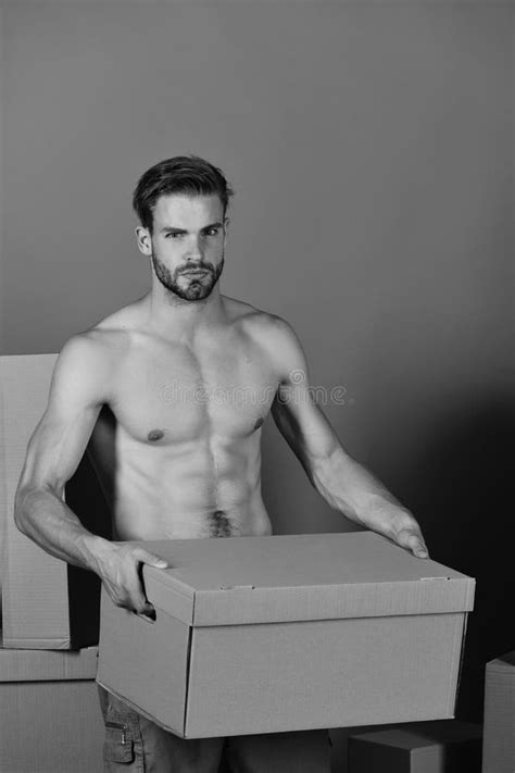 Delivery And Moving In Concept Man With Naked Torso Stock Photo
