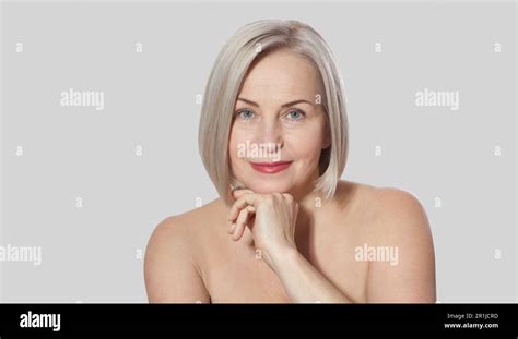 Beautiful Middle Aged Blonde Woman Shows Off Her Perfectly Well Groomed Face Macro Face