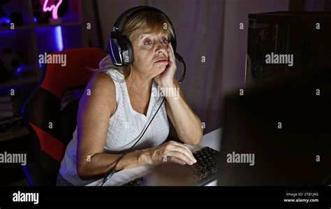 Bored As Hell Middle Aged Blonde Streamer Woman Playing Video Games In
