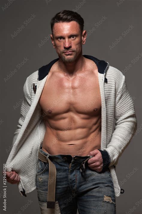 Handsome Muscular Man Posing In Studio Male Fitness Model With Naked Torso Showing Muscular And