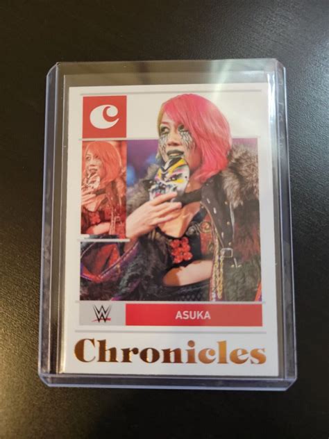 2022 Panini Chronicles WWE Asuka Chronicles Bronze Foil Parallel 11 JM