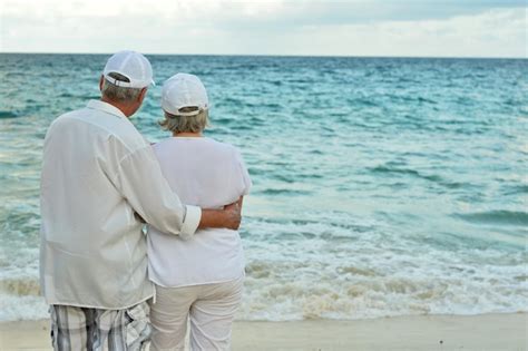 Premium Photo Portrait Of An Elderly Couple On Beach