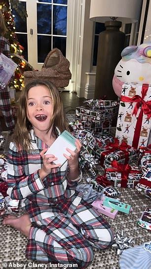 Abbey Clancy Shows Off Her Toned Figure In Snakeskin Print Bikini While Soaking In The Sun