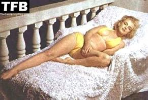 Marilyn Monroe Sexy Poses Showing Off Her Hot Figure Wearing A Yellow Bikini In A Photoshoot